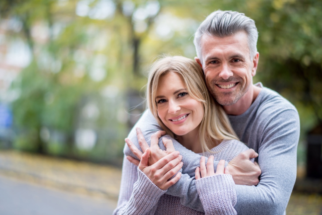 Happy mature couple after peptide therapy at our Brookfield clinic